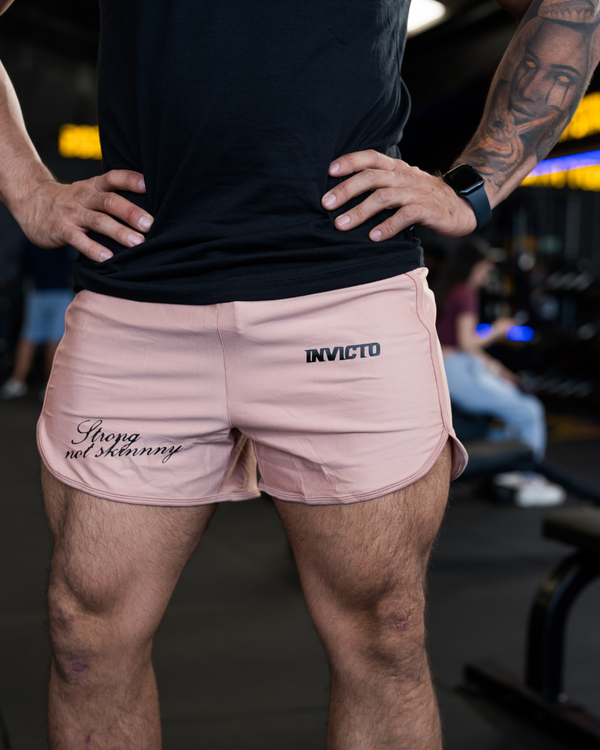 Pantaloneta corta rosada sagrado es el hierro