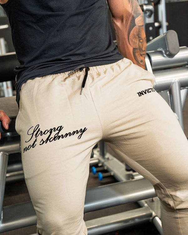 Jogger beige Colección Sagrado es el hierrro